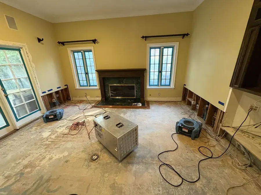 A dehumidifier drying a flood-cut room in an Arlington, VA home